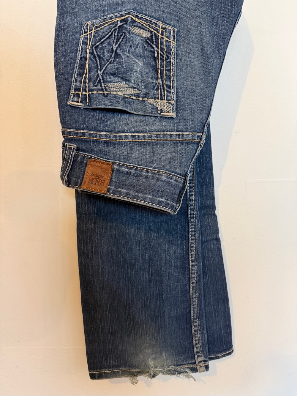 BKE womens Blue Bootcut Jeans with Distressed Pocket